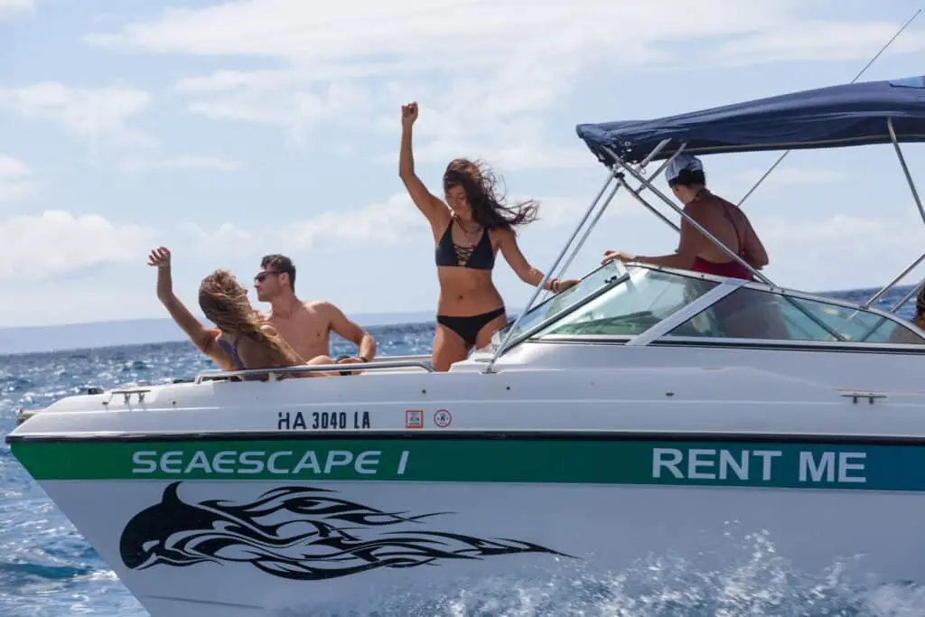 Guests aboard a Glacier Bay rental boat off Maui
